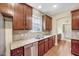 Well-equipped kitchen with granite countertops, stainless steel appliances, and abundant storage at 921 Shefford Town Dr, Rolesville, NC 27571