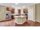 Spacious kitchen features stainless steel appliances and central island at 921 Shefford Town Dr, Rolesville, NC 27571