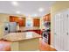 Well-designed kitchen with stainless appliances, granite counters and breakfast bar at 921 Shefford Town Dr, Rolesville, NC 27571