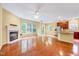 Open floor plan featuring a modern living room, fireplace, kitchen and access to the back porch at 921 Shefford Town Dr, Rolesville, NC 27571