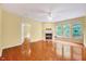 Living room with a fireplace and windows with transoms at 921 Shefford Town Dr, Rolesville, NC 27571