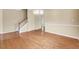 Spacious living room with hardwood floors and staircase at 921 Shefford Town Dr, Rolesville, NC 27571