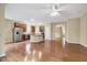 Open-concept living area with hardwood floors leading to a spacious kitchen at 921 Shefford Town Dr, Rolesville, NC 27571