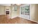 Open-concept living room with fireplace and access to sunroom at 921 Shefford Town Dr, Rolesville, NC 27571