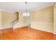 Elegant space with hardwood floors, staircase, and access to other rooms at 921 Shefford Town Dr, Rolesville, NC 27571