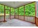 Relaxing screened porch with backyard view and railing detail at 921 Shefford Town Dr, Rolesville, NC 27571