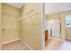 Spacious walk-in closet featuring carpet flooring and wire shelving at 921 Shefford Town Dr, Rolesville, NC 27571