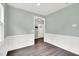 Inviting entryway with hardwood floors, neutral paint, and elegant trim at 97 Arapahoe Dr, Kenly, NC 27542