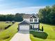 Charming two-story home features a well-manicured lawn and a two-car garage at 97 Arapahoe Dr, Kenly, NC 27542