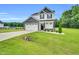 Charming two-story home with a two-car garage and landscaped front yard at 97 Arapahoe Dr, Kenly, NC 27542