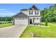Charming two-story home featuring a two-car garage and beautifully landscaped front yard at 97 Arapahoe Dr, Kenly, NC 27542