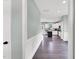 Elegant hallway leading into a bright kitchen with stainless appliances and an island at 97 Arapahoe Dr, Kenly, NC 27542