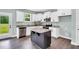 Stylish kitchen featuring granite countertops, stainless steel appliances and dark wood flooring at 97 Arapahoe Dr, Kenly, NC 27542