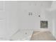 Simple white laundry room featuring all the necessary hookups at 97 Arapahoe Dr, Kenly, NC 27542