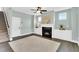 Living room showcasing a fireplace with built-ins and stairs leading to the second floor at 97 Arapahoe Dr, Kenly, NC 27542