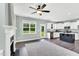 Open concept living and kitchen area with fireplace, built-ins, and lots of natural light at 97 Arapahoe Dr, Kenly, NC 27542