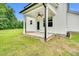 Covered back patio with ceiling fan, perfect for outdoor relaxation at 97 Arapahoe Dr, Kenly, NC 27542