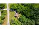 Aerial view of the home's private backyard pond and surrounding green trees at 973 Rebecca Ln, Siler City, NC 27344