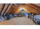 Expansive attic space with plywood flooring, exposed rafters, and abundant storage possibilities at 973 Rebecca Ln, Siler City, NC 27344