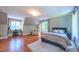 Bedroom with sloped ceilings featuring hardwood floors, a chair, and a desk at 973 Rebecca Ln, Siler City, NC 27344