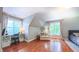 Bedroom with sloped ceilings, a cozy sitting area, and a desk area with natural light at 973 Rebecca Ln, Siler City, NC 27344