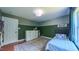 Well-lit bedroom with a plush rug, two tone walls, and window views at 973 Rebecca Ln, Siler City, NC 27344
