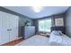 Comfortable bedroom with wood floors, neutral colors, and a large window for ample light at 973 Rebecca Ln, Siler City, NC 27344