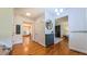 Bright foyer with hardwood floors, gray storage cabinet, and views into adjacent rooms at 973 Rebecca Ln, Siler City, NC 27344