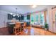 Bright kitchen featuring dark green cabinets, a large island, and a cozy breakfast nook at 973 Rebecca Ln, Siler City, NC 27344