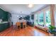 Spacious kitchen features green cabinets, an island with seating, and stainless steel appliances at 973 Rebecca Ln, Siler City, NC 27344