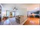 Bright open living area with hardwood floors and view of kitchen and backyard at 973 Rebecca Ln, Siler City, NC 27344