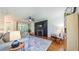 Comfortable living room with a fireplace, TV, ceiling fan, and large windows at 973 Rebecca Ln, Siler City, NC 27344