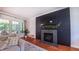 Living room featuring a modern fireplace, large windows and comfortable seating at 973 Rebecca Ln, Siler City, NC 27344