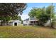View of the backyard with a shed and a hammock at 1001 N Orange Ave, Dunn, NC 28334