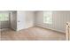 Bedroom featuring carpeting, windows, and neutral color palette at 1001 N Orange Ave, Dunn, NC 28334