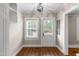Cozy entryway features wood floors, built-in shelving, and a view to the outside at 1001 N Orange Ave, Dunn, NC 28334