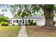 Charming home with manicured lawn and mature trees at 1001 N Orange Ave, Dunn, NC 28334