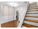 Inviting staircase with wood treads and white risers, leading to the upper level of the home at 1001 N Orange Ave, Dunn, NC 28334