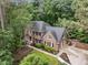 Beautiful home featuring manicured landscaping and mature trees providing privacy and curb appeal at 1004 Staffield Lane Ln, Chapel Hill, NC 27516