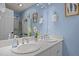 Lovely bathroom featuring double sinks with modern fixtures and stylish wall decor at 1004 Staffield Lane Ln, Chapel Hill, NC 27516