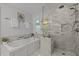 Bright and modern bathroom with a soaking tub and glass enclosed shower at 1004 Staffield Lane Ln, Chapel Hill, NC 27516