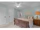 Bedroom with wood bed frame, neutral carpet and good light at 1004 Staffield Lane Ln, Chapel Hill, NC 27516