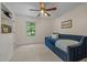 Cozy bedroom featuring a daybed, built-in shelving, and natural light from the window at 1004 Staffield Lane Ln, Chapel Hill, NC 27516