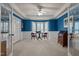 Bright bonus room with chair railing, blue walls, a ceiling fan, and bay window at 1004 Staffield Lane Ln, Chapel Hill, NC 27516
