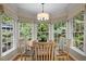 Bright breakfast nook with large windows offering natural light and views of the private backyard at 1004 Staffield Lane Ln, Chapel Hill, NC 27516
