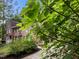 Charming brick two-story home with mature trees and manicured lawn at 1004 Staffield Lane Ln, Chapel Hill, NC 27516