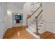 Beautiful foyer features a staircase, hardwood floors and view to a bonus room through French doors at 1004 Staffield Lane Ln, Chapel Hill, NC 27516