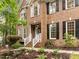 Charming brick home featuring a welcoming front entrance and manicured landscaping at 1004 Staffield Lane Ln, Chapel Hill, NC 27516