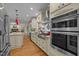 Spacious kitchen with stainless appliances, granite counters, and hardwood floors at 1004 Staffield Lane Ln, Chapel Hill, NC 27516