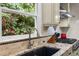 Updated kitchen features granite countertops, custom cabinets and a view of the backyard at 1004 Staffield Lane Ln, Chapel Hill, NC 27516